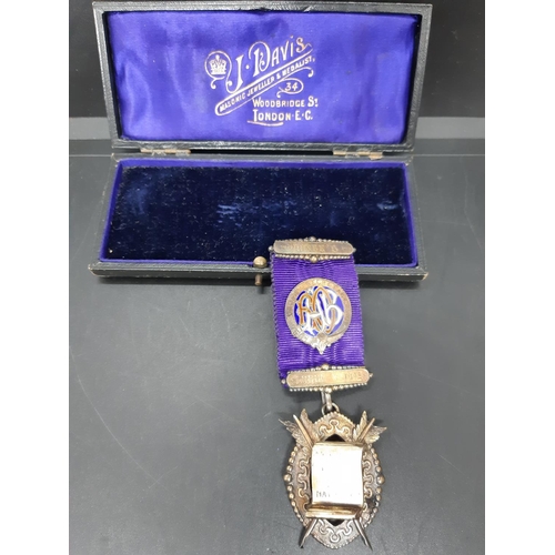 130 - Two items to include an early 20th century masonic presentation medallion presented to Brother Frede... 