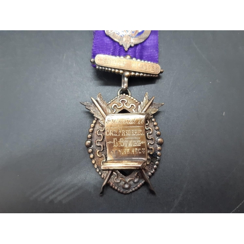 130 - Two items to include an early 20th century masonic presentation medallion presented to Brother Frede... 