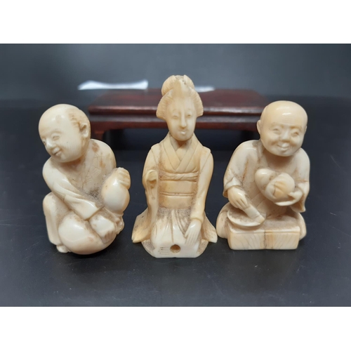 131 - Three Japanese carved netsuke figurines