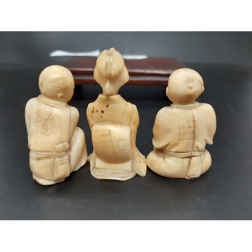 131 - Three Japanese carved netsuke figurines