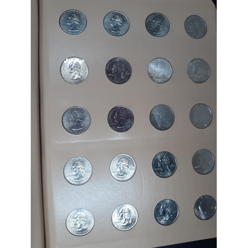 139 - A Dansco Archival slipcased coin album containing 100 Statehood commemorative quarters to include De... 