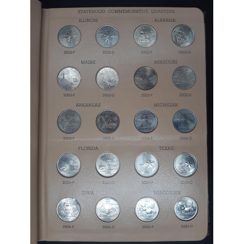 139 - A Dansco Archival slipcased coin album containing 100 Statehood commemorative quarters to include De... 