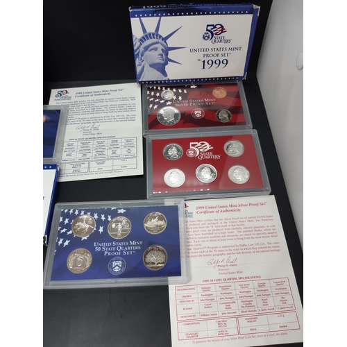 140 - A collection of five coin sets to include a Royal Canadian Mint uncirculated 2006 dollar, United Sta... 