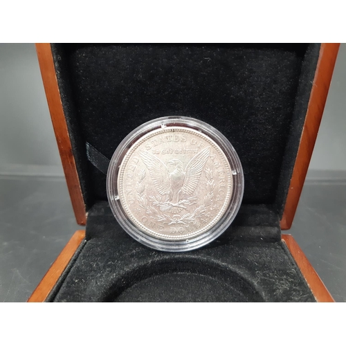 143 - A cased silver 1921 US Morgan dollar designed by George T Morgan and produced at the Denver Mint