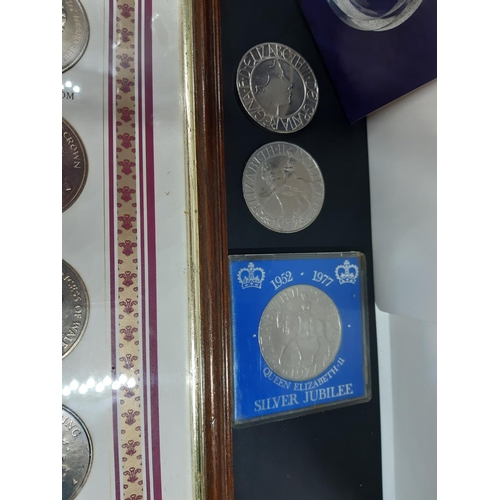 145A - A collection of coins to include a framed Royal wedding coin collection dated 1981, 2003 Jubilee £5 ... 