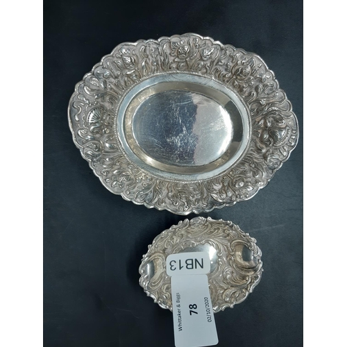 78 - Two items to include a hallmarked 800 grade silver trinket dish with repousse floral design and a sm... 