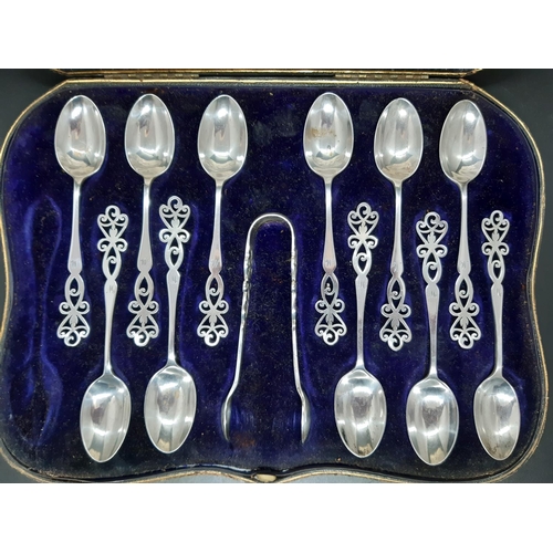 96 - A cased set of eleven hallmarked Birmingham silver teaspoons and matching sugar tongs by Elkington o... 