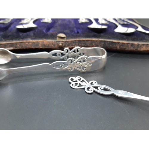 96 - A cased set of eleven hallmarked Birmingham silver teaspoons and matching sugar tongs by Elkington o... 