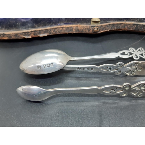 96 - A cased set of eleven hallmarked Birmingham silver teaspoons and matching sugar tongs by Elkington o... 