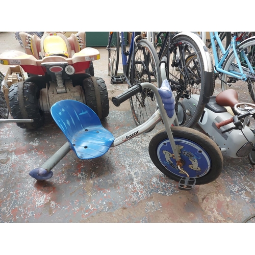 663 - A blue and grey Razor stunt tricycle