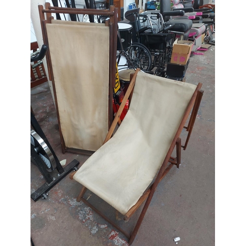 679 - A pair of traditional wooden deck chairs with beige upholstery