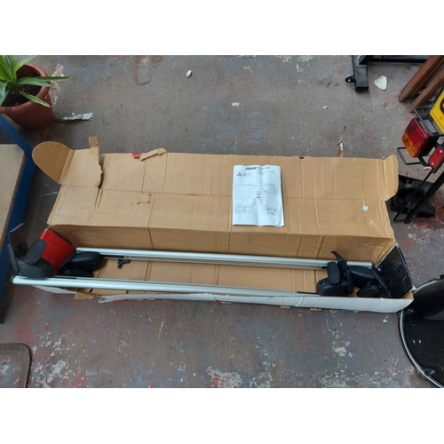 681 - A boxed pair of Atera car roof bars