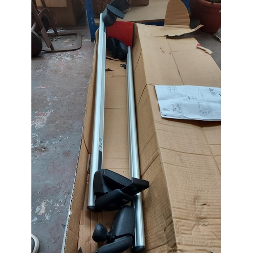 681 - A boxed pair of Atera car roof bars