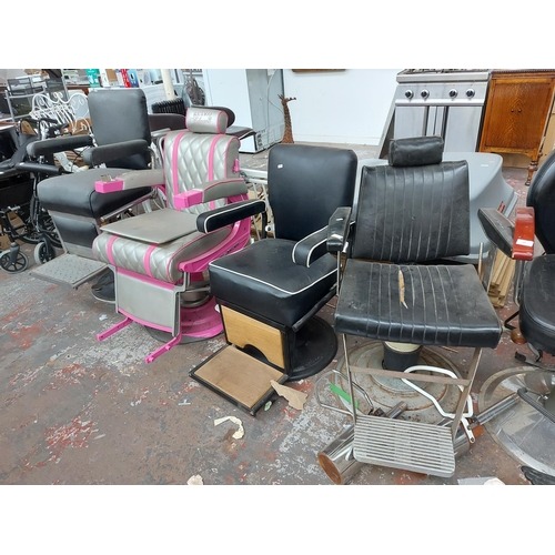 684 - Four vintage barber chairs to include a heavy black vinyl on chrome gas powered support, reproductio... 