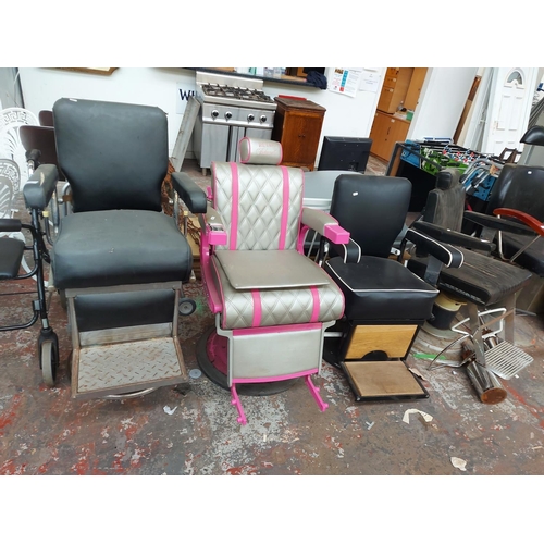 684 - Four vintage barber chairs to include a heavy black vinyl on chrome gas powered support, reproductio... 