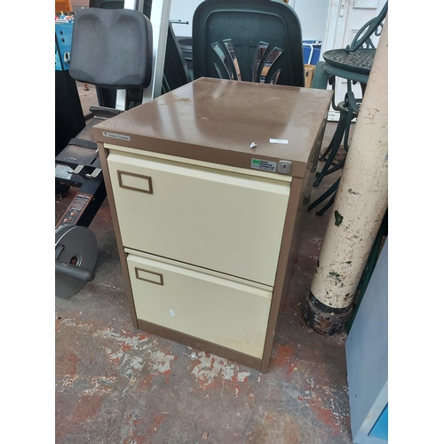 687 - A Vickers Trimline brown and cream metal two drawer office filing cabinet