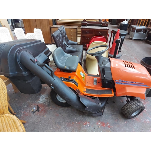 691 - An orange and grey Husqvarna LT112 ride on tractor lawn mower with Briggs and Stratton 12HP engine, ... 