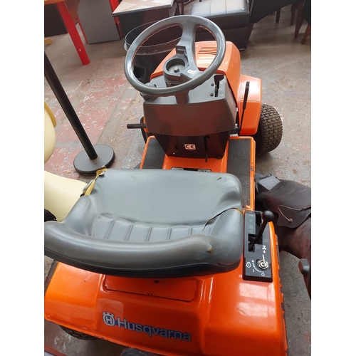 691 - An orange and grey Husqvarna LT112 ride on tractor lawn mower with Briggs and Stratton 12HP engine, ... 