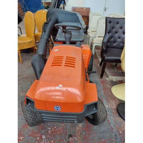 691 - An orange and grey Husqvarna LT112 ride on tractor lawn mower with Briggs and Stratton 12HP engine, ... 