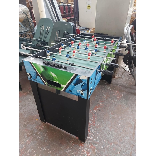 695 - A 4' x 2' table football game with ball