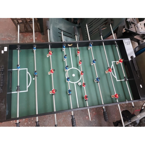 695 - A 4' x 2' table football game with ball