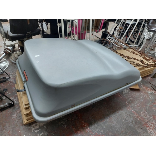 696 - A grey Auto-Plas International Ltd car roof box - measuring approx. 50