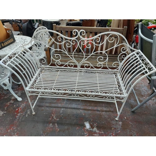 701 - An unusual aluminium white painted ornate two seat garden bench