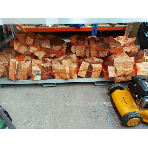 710 - Twelve bags of fire logs