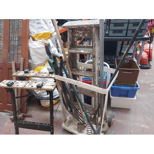 712 - A mixed lot to include vintage wooden five tread step ladders, Black and Decker Workmate style workb... 