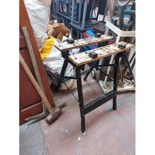 712 - A mixed lot to include vintage wooden five tread step ladders, Black and Decker Workmate style workb... 