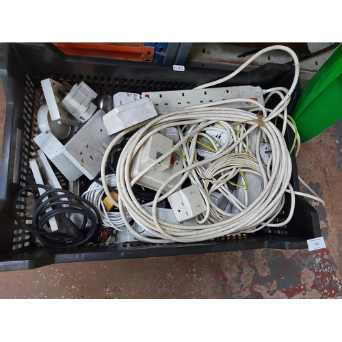 719 - A box containing electrical items to include caravan hook up lead, plug sockets, multi plugs, variou... 