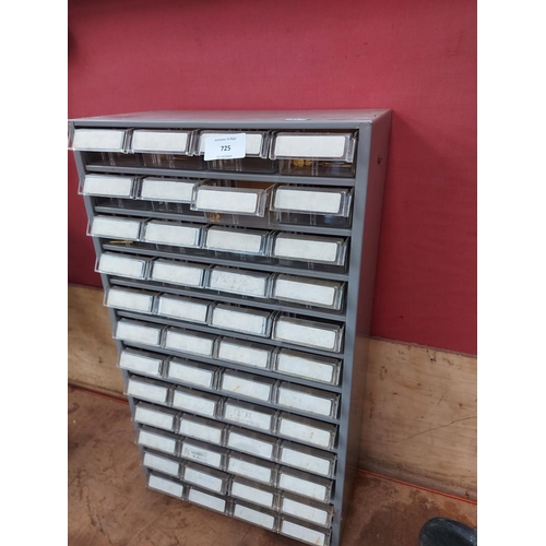 725 - A grey metal workbench storage cabinet with 48 drawers and contents