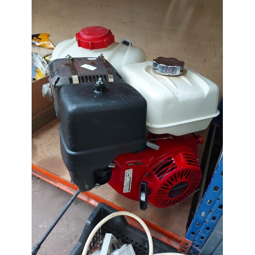 728 - Two items to include a red Honda GX390 complete petrol engine together with a Solo rucksack pressure... 