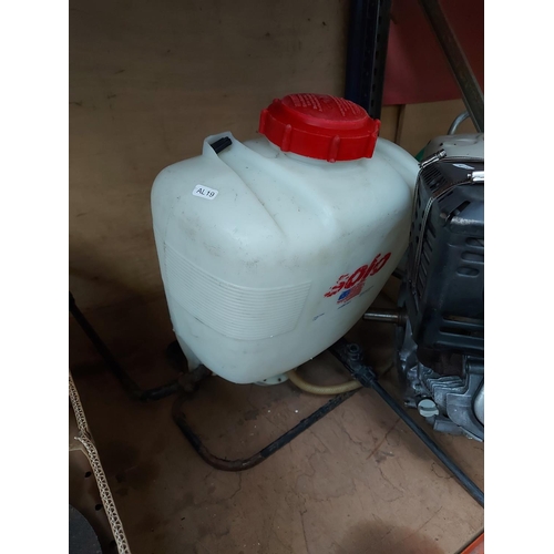 728 - Two items to include a red Honda GX390 complete petrol engine together with a Solo rucksack pressure... 