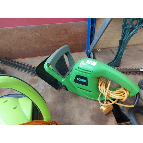 730 - Two items to include a green Xceed electric hedge trimmer with 20