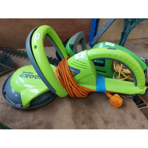 730 - Two items to include a green Xceed electric hedge trimmer with 20