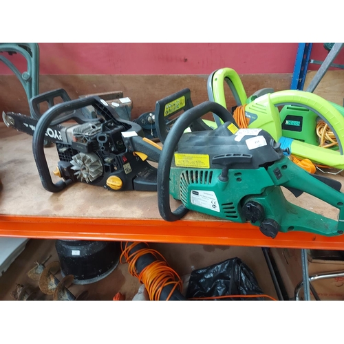 731 - Two petrol chainsaws for spares or repairs to include a black and green Gardenline GPCS46Z-52579 and... 