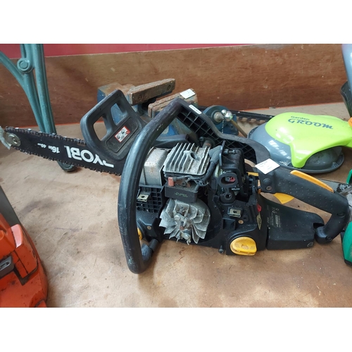 731 - Two petrol chainsaws for spares or repairs to include a black and green Gardenline GPCS46Z-52579 and... 