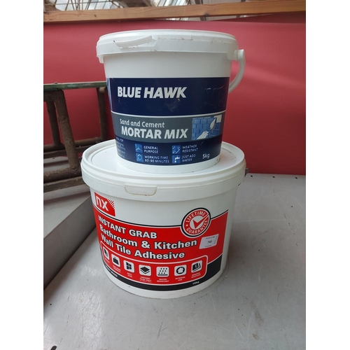 745 - Two items to include a 15KG bucket of NX tile adhesive and a 5KG bucket of Blue Hawk sand and cement... 