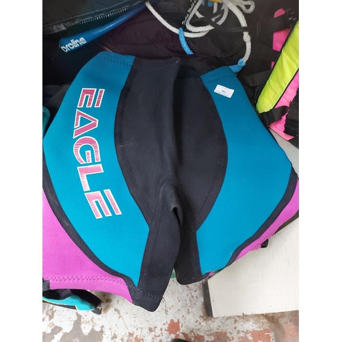 746 - A mixed lot of water ski equipment to include Americas Cup life jacket, Eagle ski shorts, wetsuit, P... 