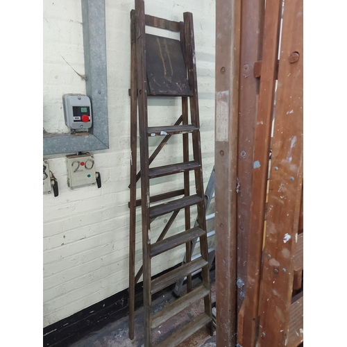 781 - A set of vintage wooden 8 tread step ladders