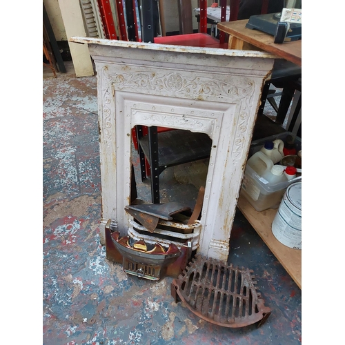 783 - A mixed lot of fireplace parts to include cast iron bedroom fireplace, hearth, damper etc.