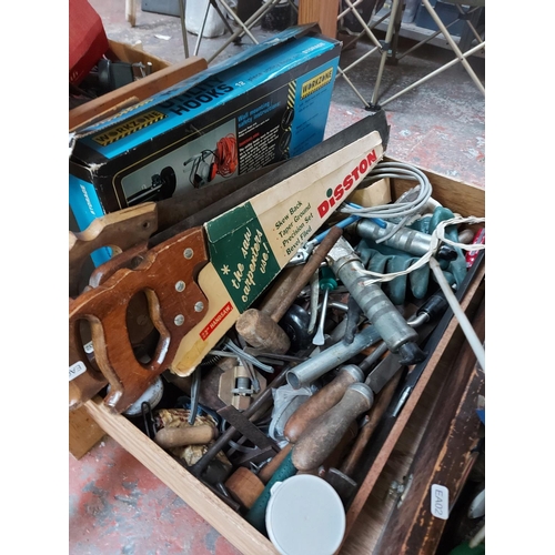 829 - Three boxes of good quality hand tools to include wooden handled files, handsaws, grease guns, oil c... 