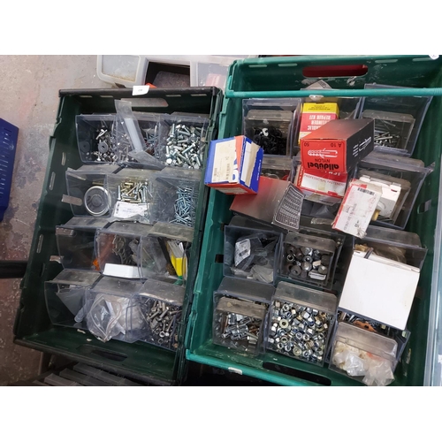 857 - A mixed lot of toolboxes, cases and boxes containing nuts, bolts, pot rivets, tools, wall fixings et... 