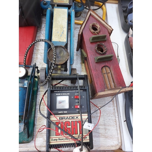 888 - A mixed lot of eight items to include a blue Master Mechanic 2 ton trolley jack, a Bradex battery ch... 