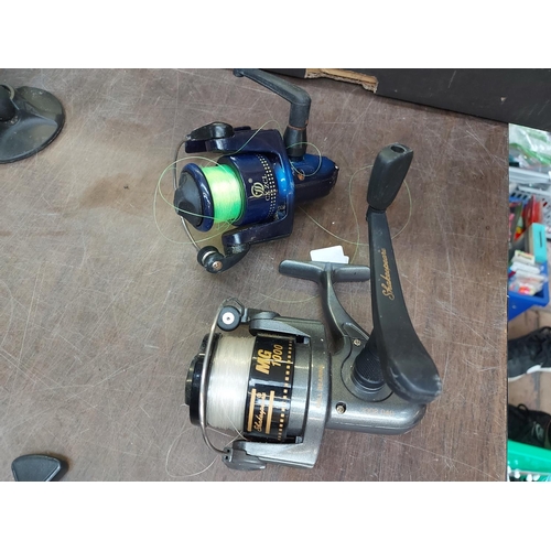 893 - Four various fishing reels to include Shakespeare MG1000 and Mark 2, Abu Garcia Cardinal and JW 200