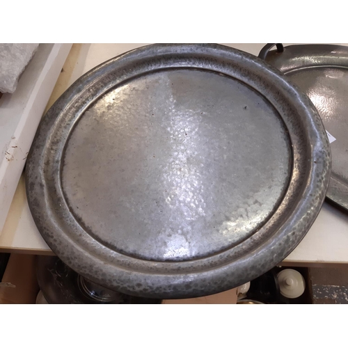 152 - Two Arts & Crafts hammered pewter trays to include a W & Co twin handled example and a circular Tudr... 