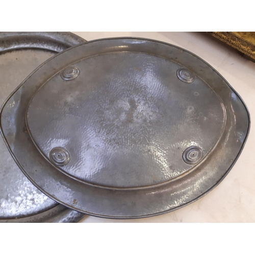 152 - Two Arts & Crafts hammered pewter trays to include a W & Co twin handled example and a circular Tudr... 