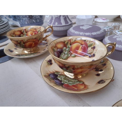 206 - Four Aynsley Orchard Gold tea cups and saucers (see condition report)