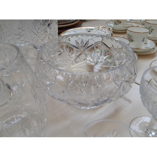 212 - A large collection of good quality glassware and cut crystal to include four decanters, spherical bo... 